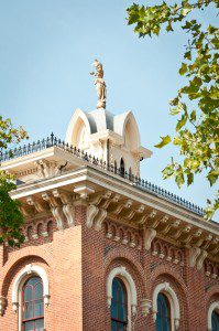 A building with a statue on top of it